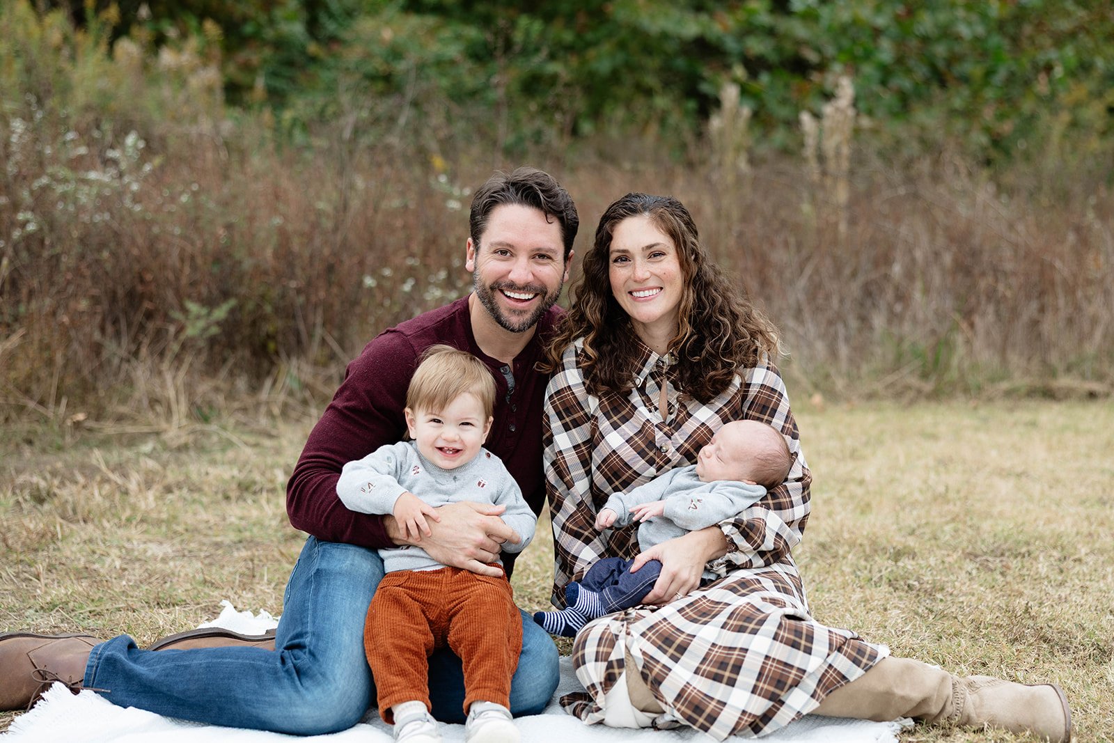 Kris and Laura Miller with their two sons — the family behind Stillman Properties in Charlotte, NC