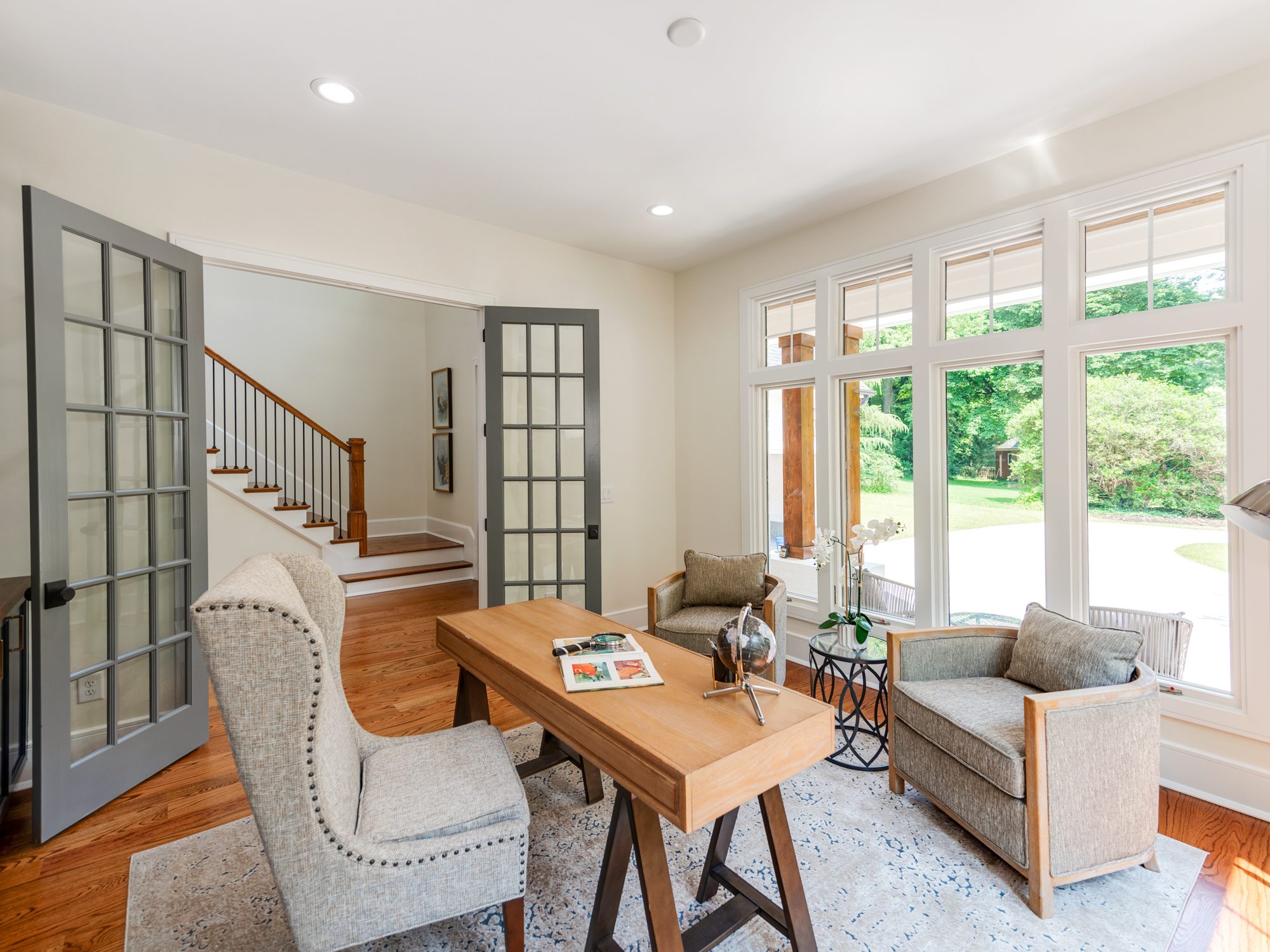View into the office from the foyer with steel-framed glass doors — Brantham by Stillman Properties Charlotte NC