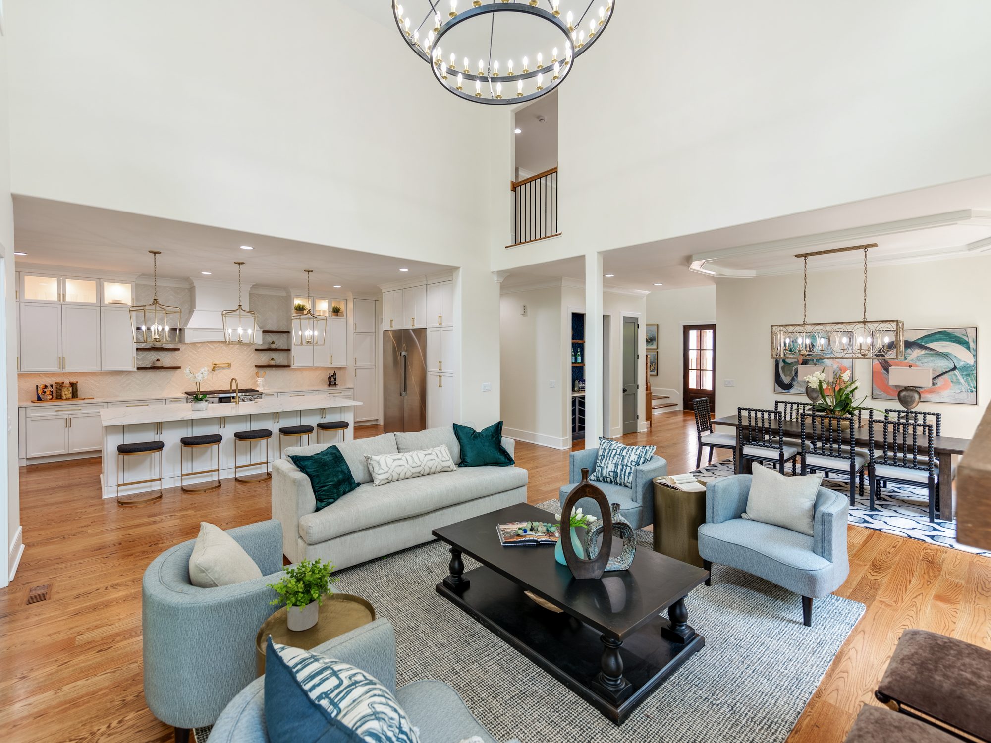 Great room wide view showing connection to kitchen and dining — Brantham by Stillman Properties Charlotte NC
