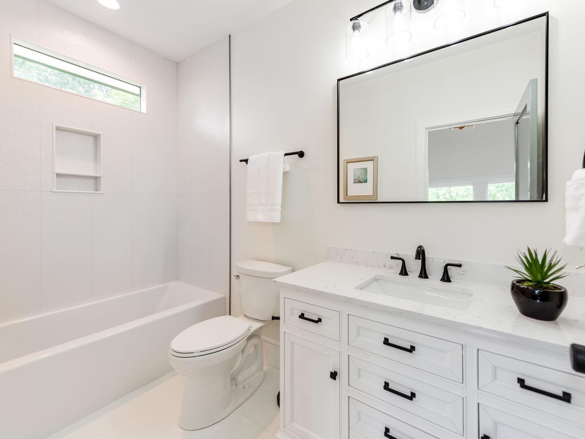 Guest bath with single vanity and tub-shower combination — Brantham by Stillman Properties Charlotte NC