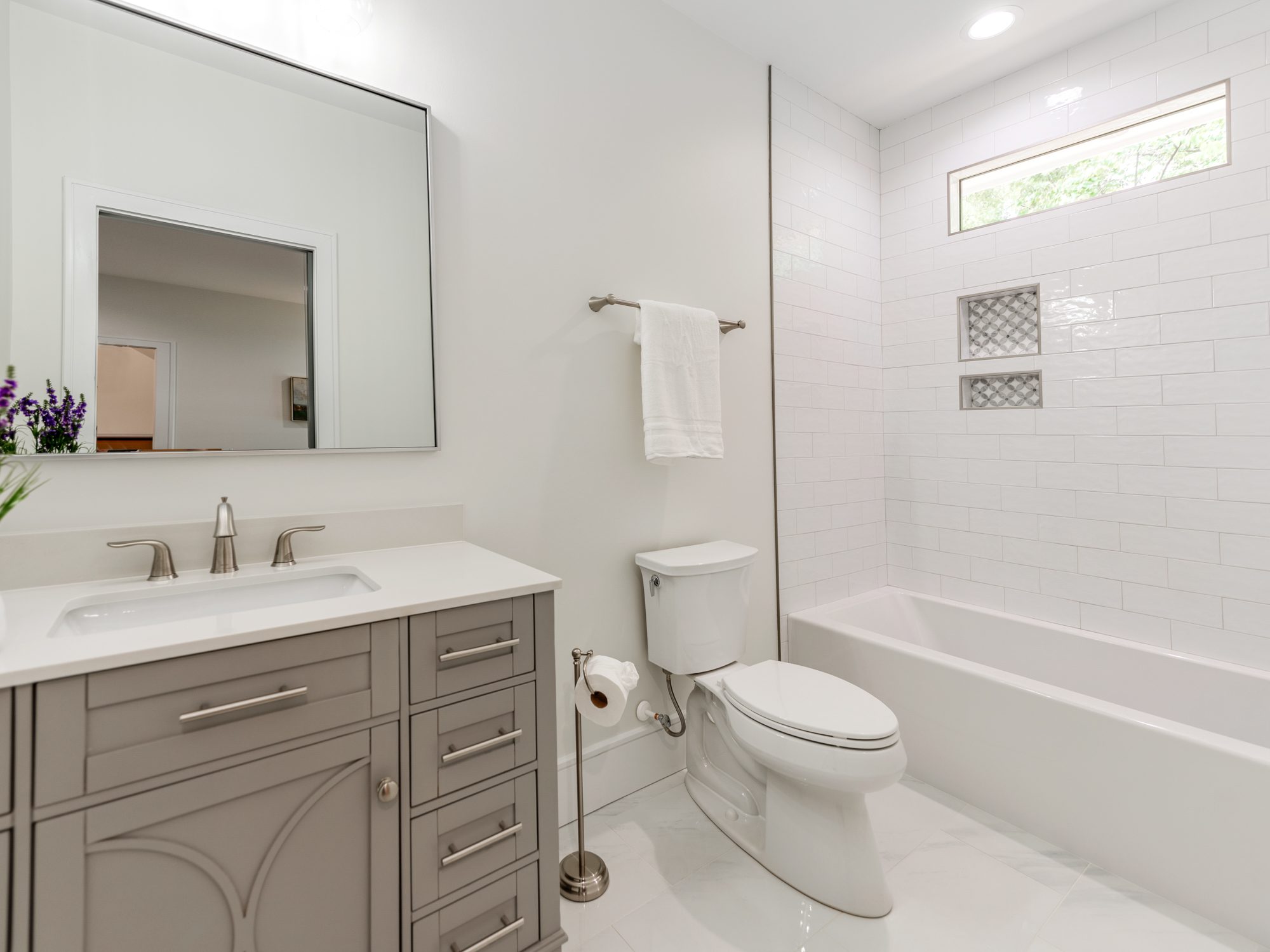 Fourth guest bath with shaker vanity and brass fixtures — Brantham by Stillman Properties Charlotte NC