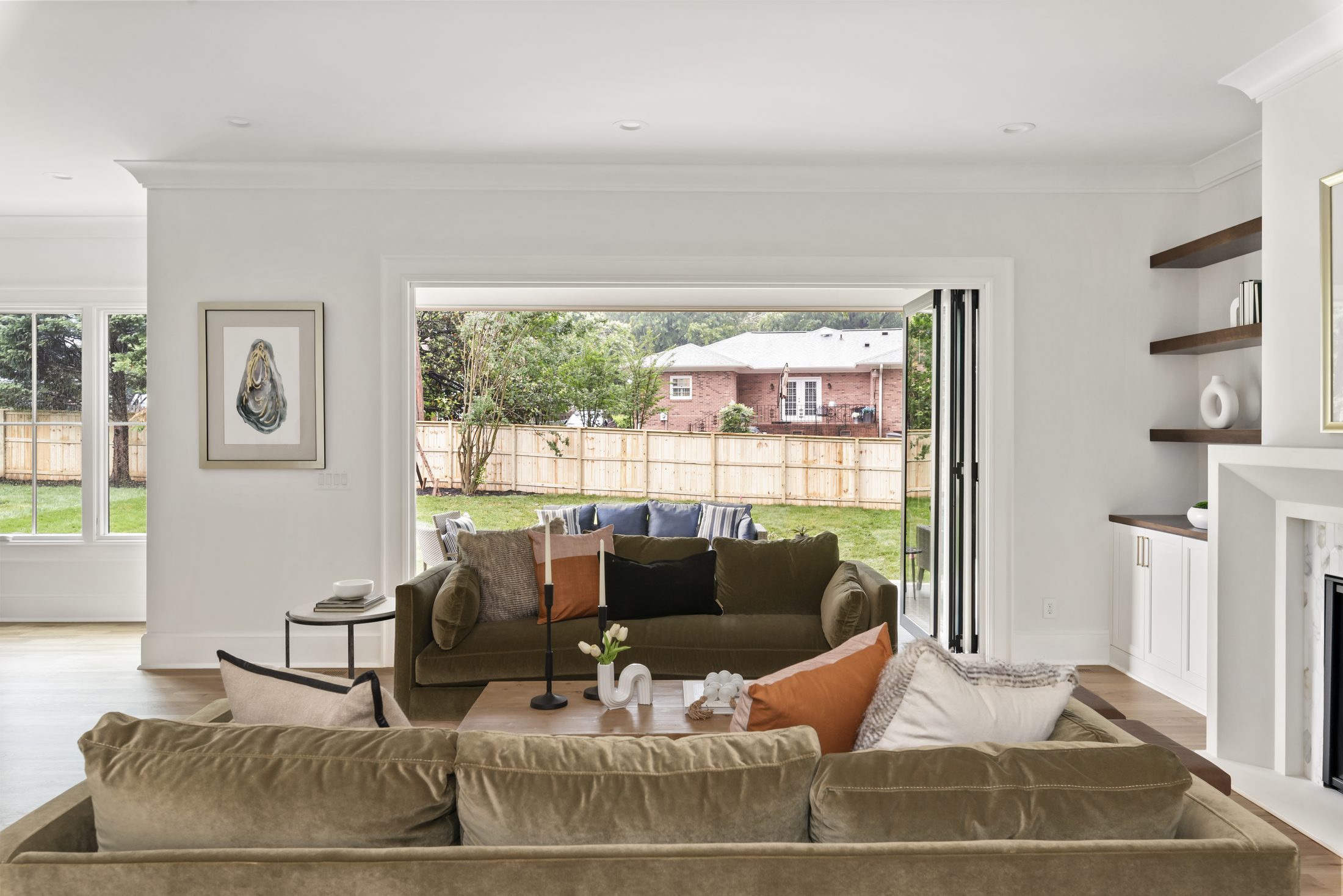 Open-concept view from the great room toward the kitchen and dining area — Bywood by Stillman Properties Charlotte NC