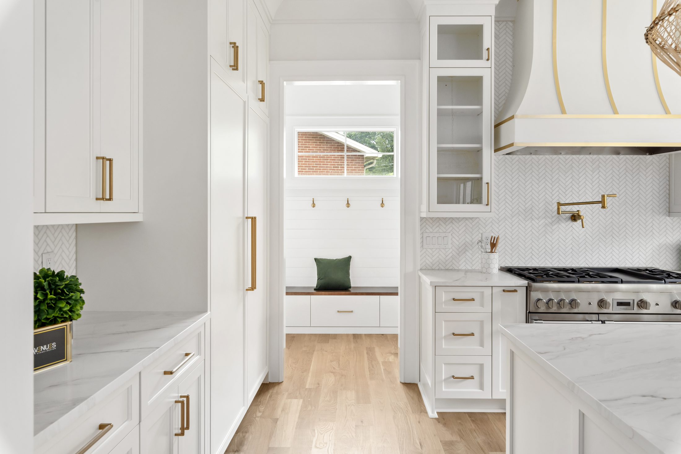 Kitchen looking through to the built-in mudroom bench — Bywood by Stillman Properties Charlotte NC