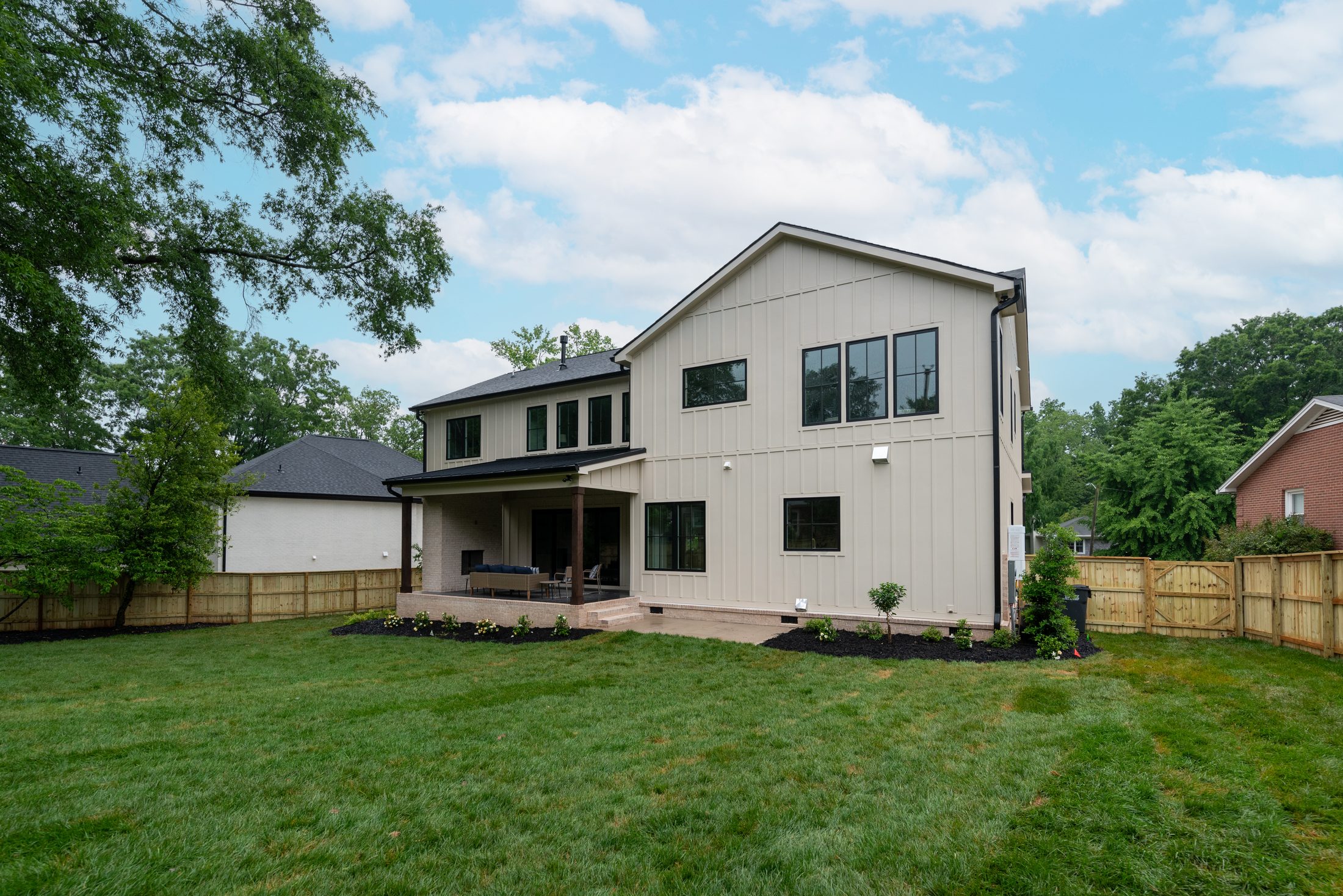 Rear view of Bywood from across the backyard showing the full elevation — Stillman Properties Charlotte NC