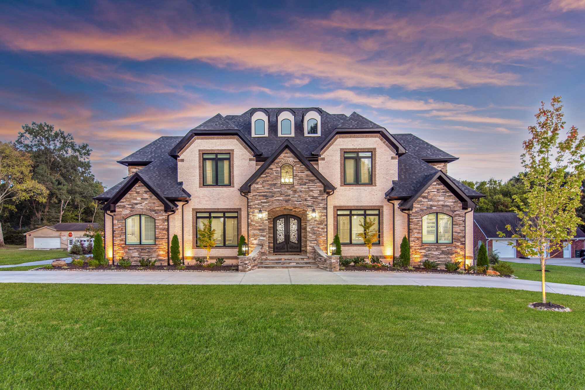 Coddle Creek custom estate home in Concord NC by Stillman Properties — front exterior at twilight