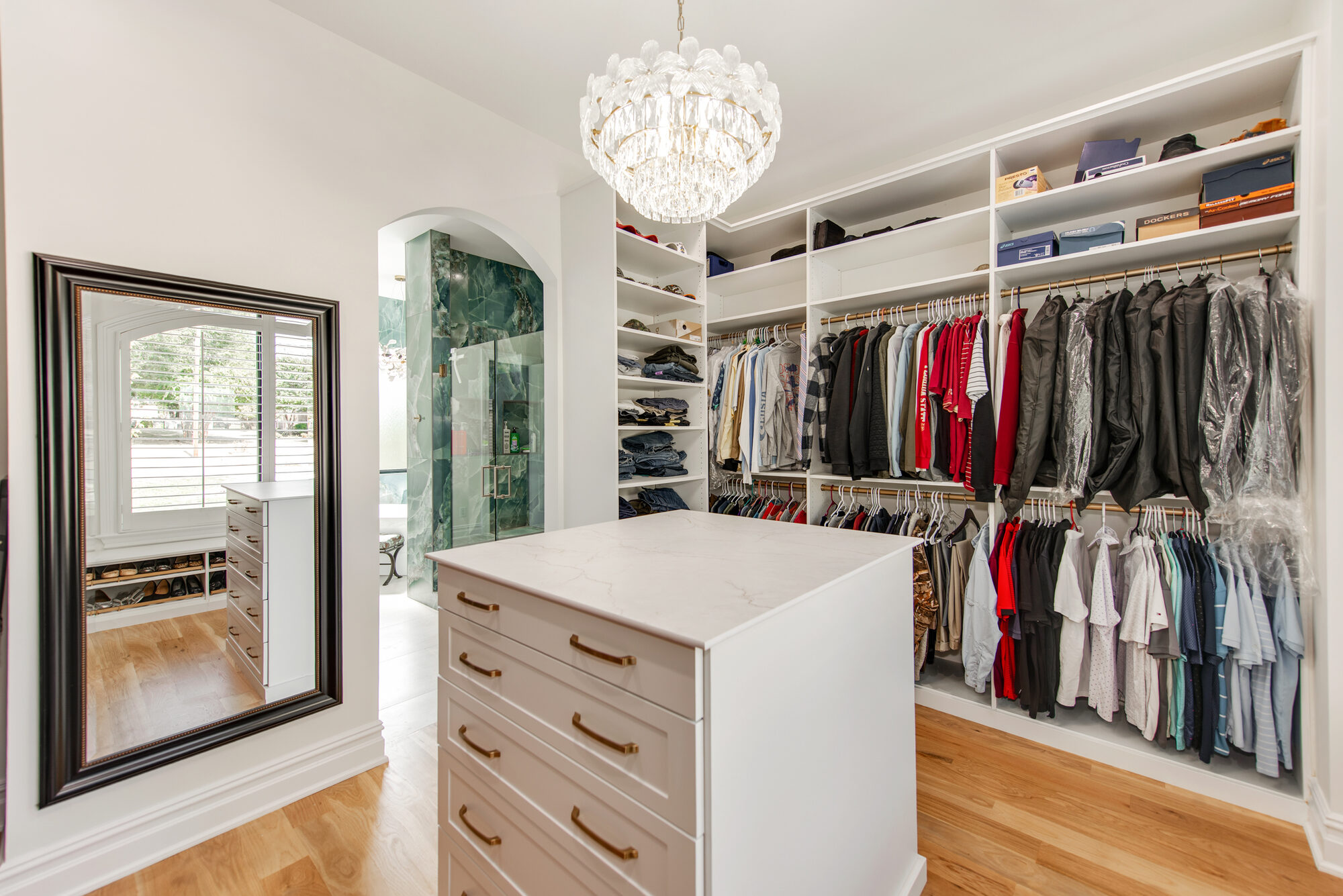 Primary closet alternate angle showing built-in drawers and his-side hanging — Coddle Creek by Stillman Properties Concord NC