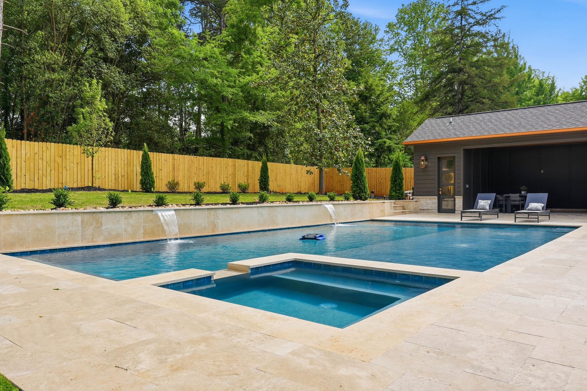 Pool and integrated spa from the cabana side with travertine deck — Creola custom home in Charlotte NC by Stillman Properties