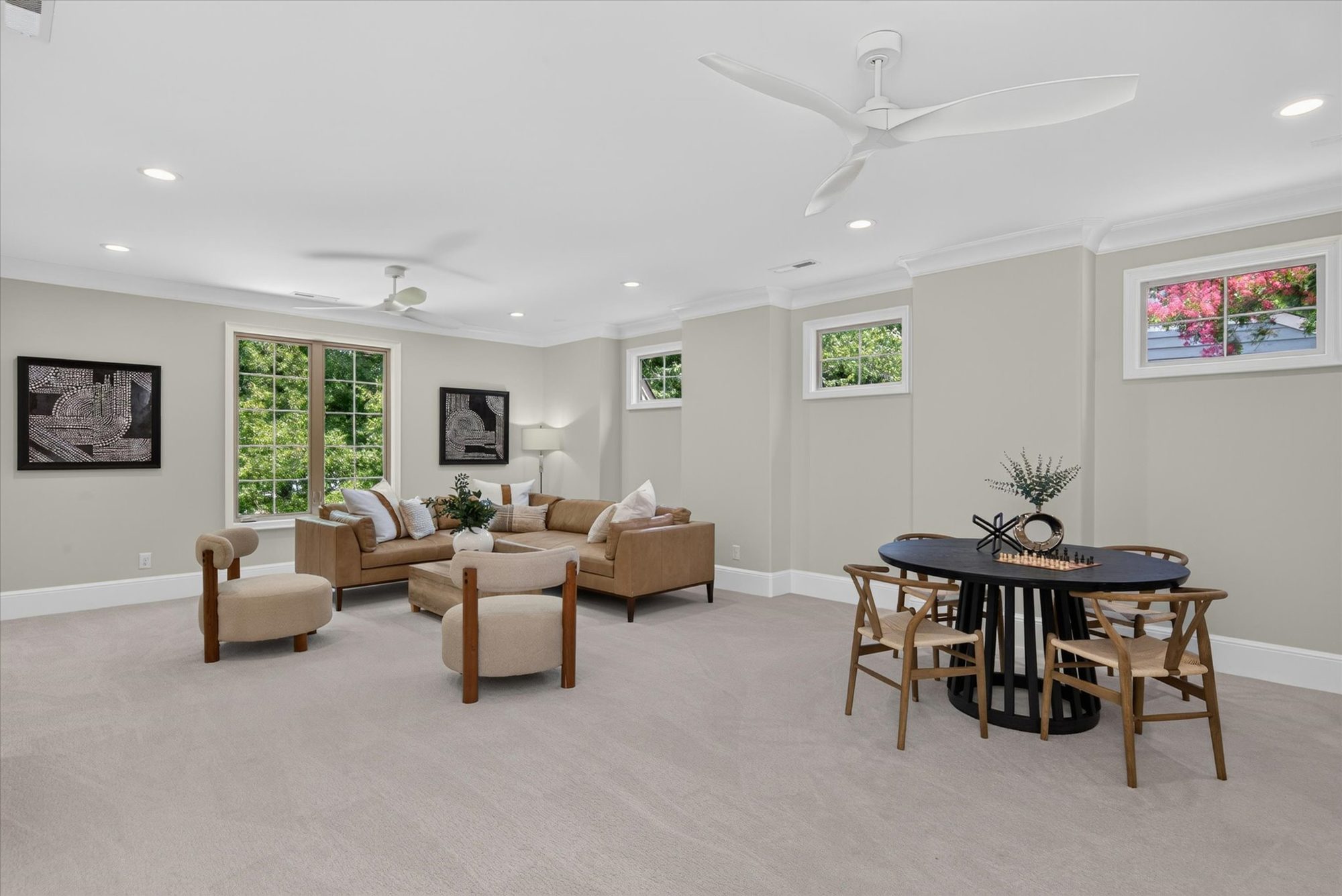 Upper-level bonus room at Heather with lounge seating, games table, and clerestory windows — Heather by Stillman Properties Charlotte NC