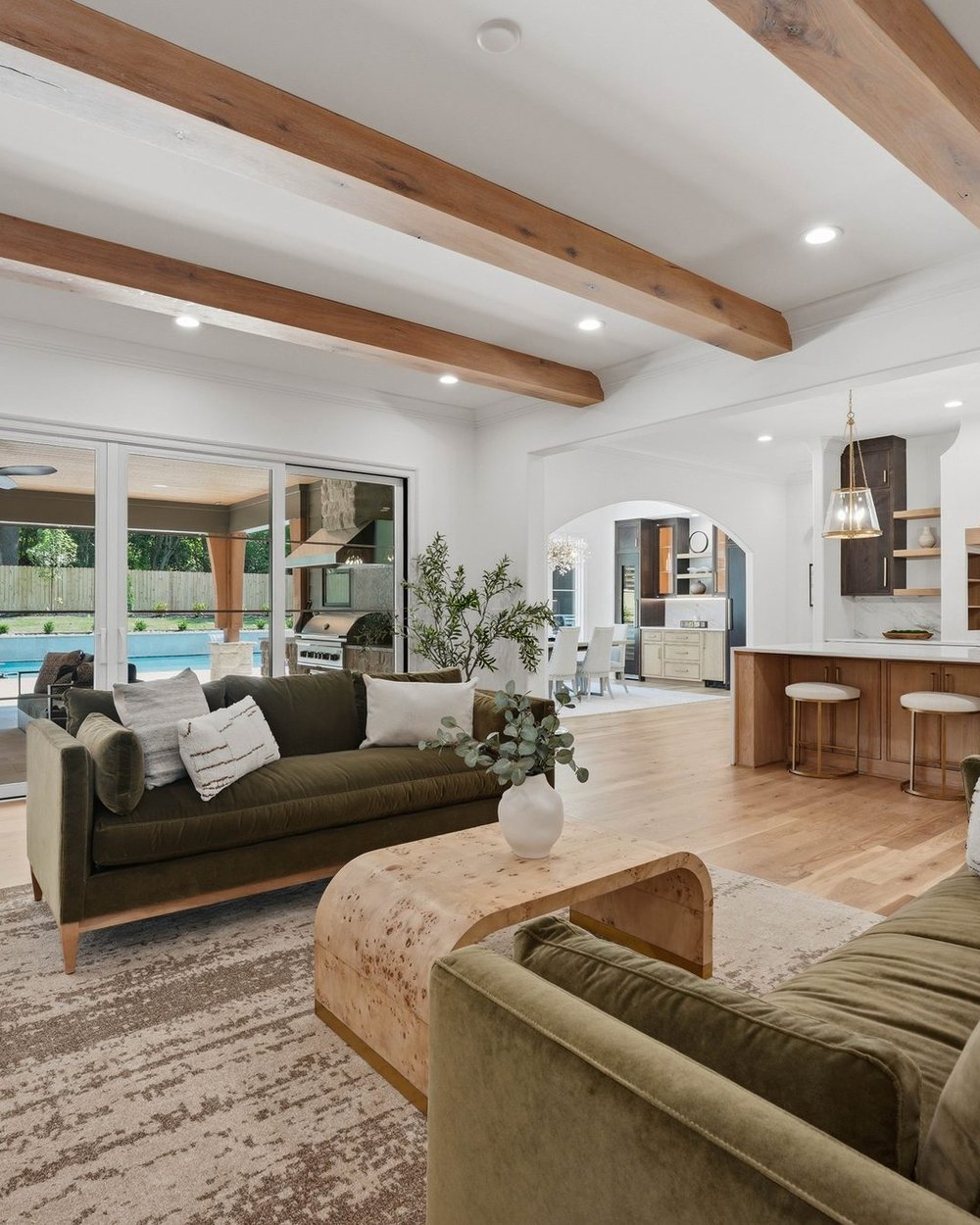 Great room with hand-hewn ceiling beams — Creola, a Stillman Properties custom home