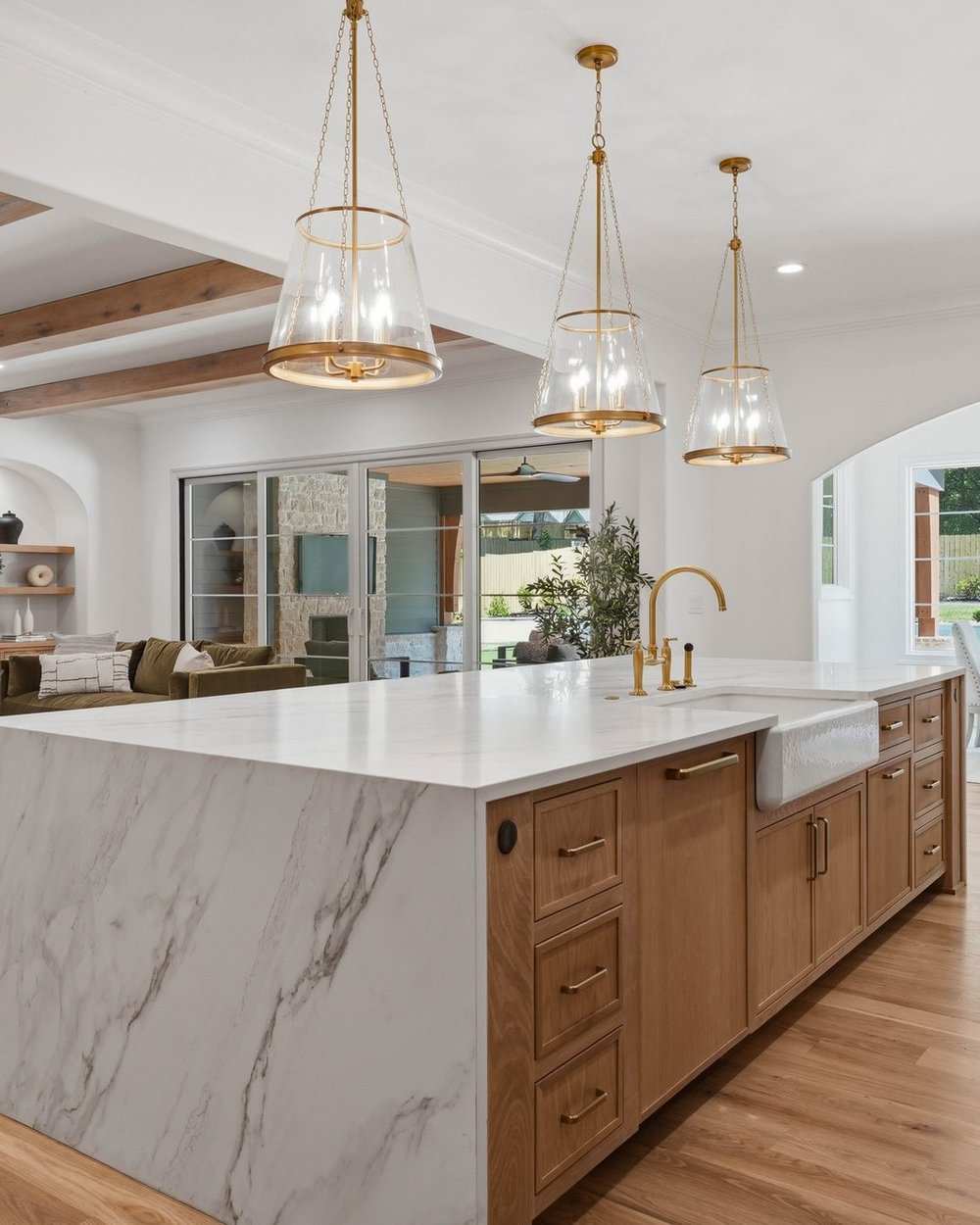 Chef's kitchen with waterfall calacatta island — Creola, a Stillman Properties custom home