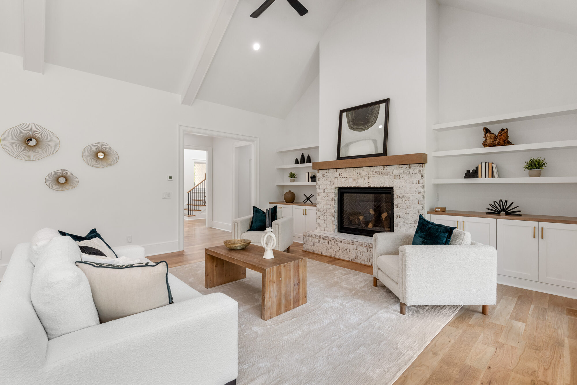 Walker great room alternate angle showing the vaulted ceiling and built-in bookshelves — Stillman Properties Cotswold Charlotte NC