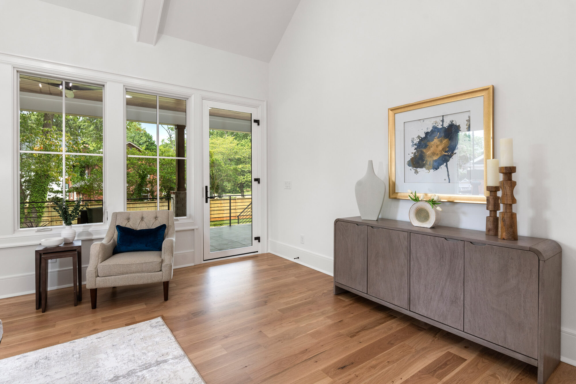 Walker primary suite sitting area with French door to the private deck and clean millwork — Stillman Properties Cotswold Charlotte NC