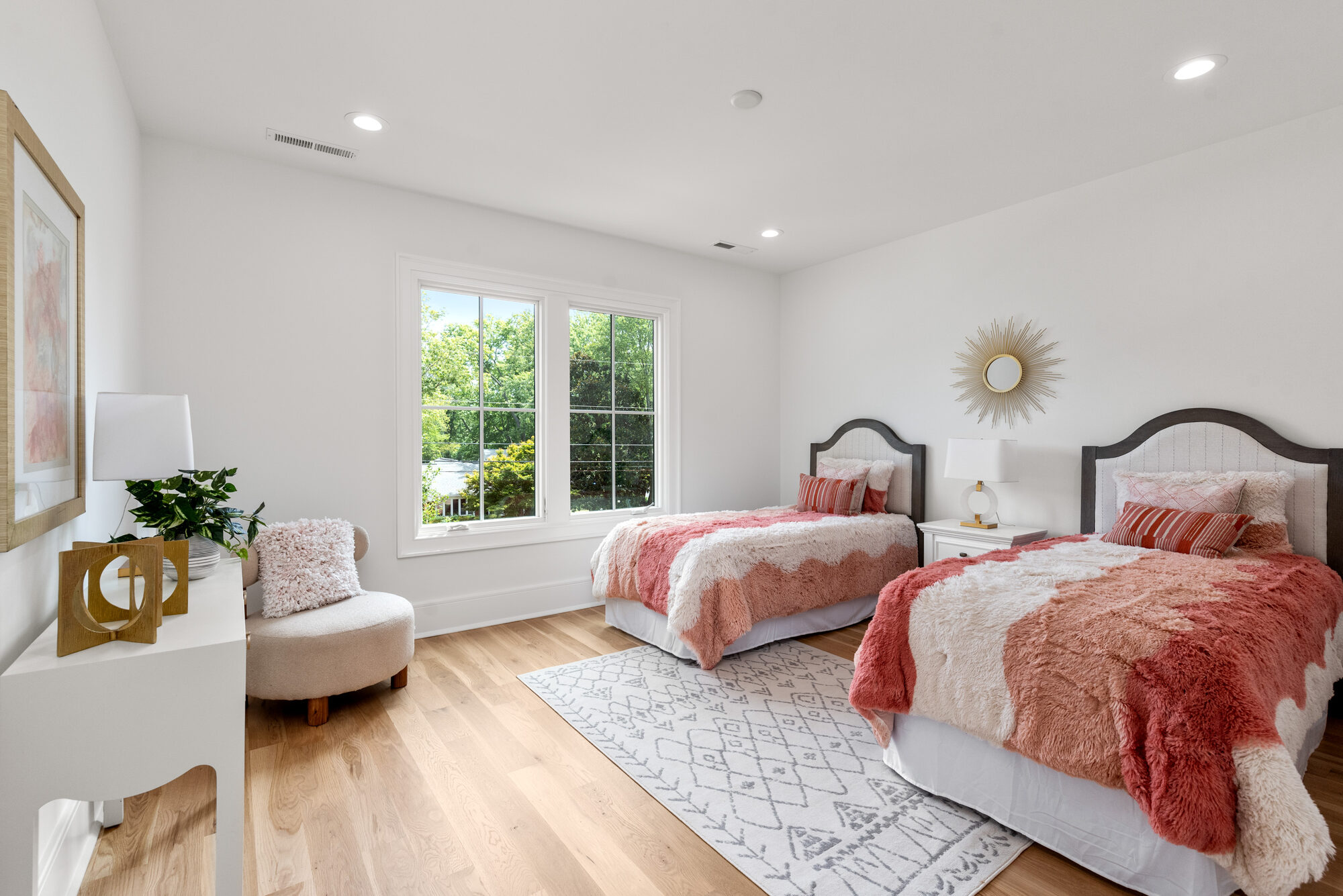 Walker children's bedroom with twin upholstered beds and sunburst mirror — Stillman Properties Cotswold Charlotte NC