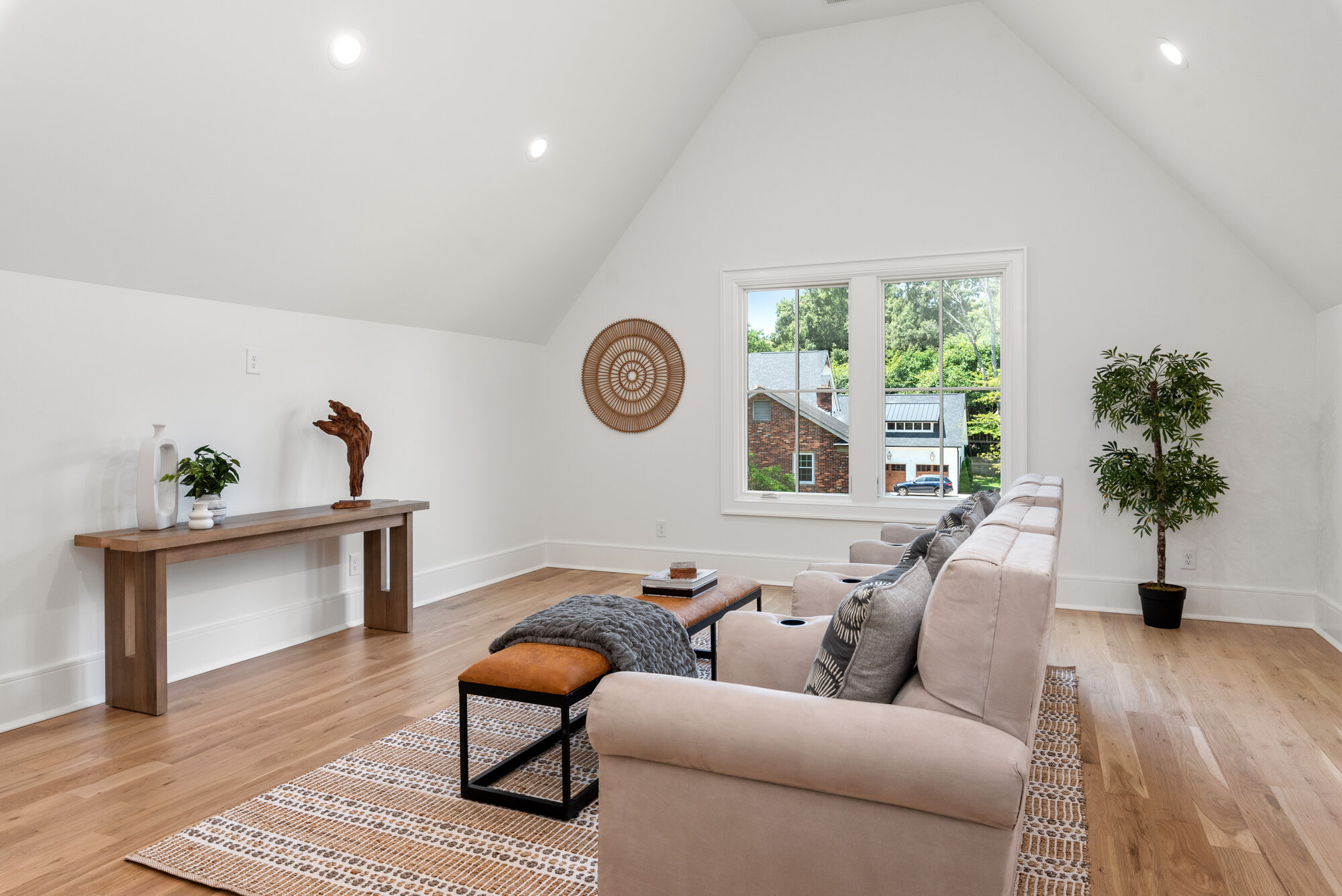 Walker upstairs sitting area with cathedral ceiling and bright casement windows — Stillman Properties Cotswold Charlotte NC