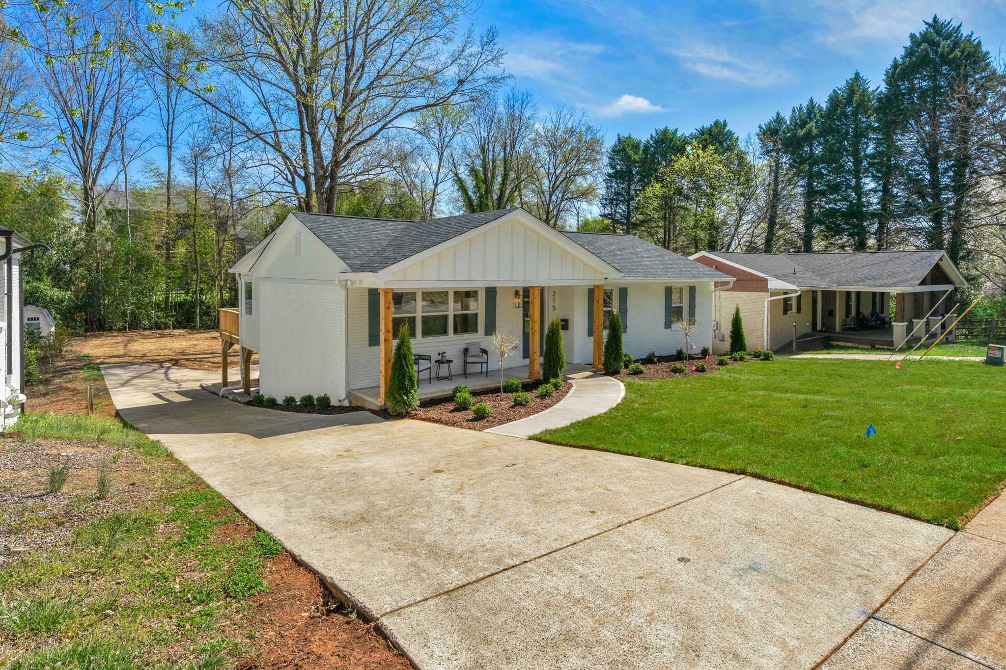 Driveway approach to the Wyanoke renovation with new concrete and fresh sod — Stillman Properties Charlotte NC