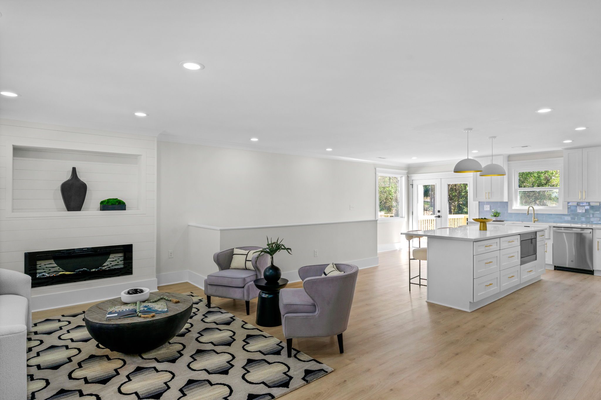Living room with linear fireplace and built-in niches — Wyanoke by Stillman Properties Charlotte NC