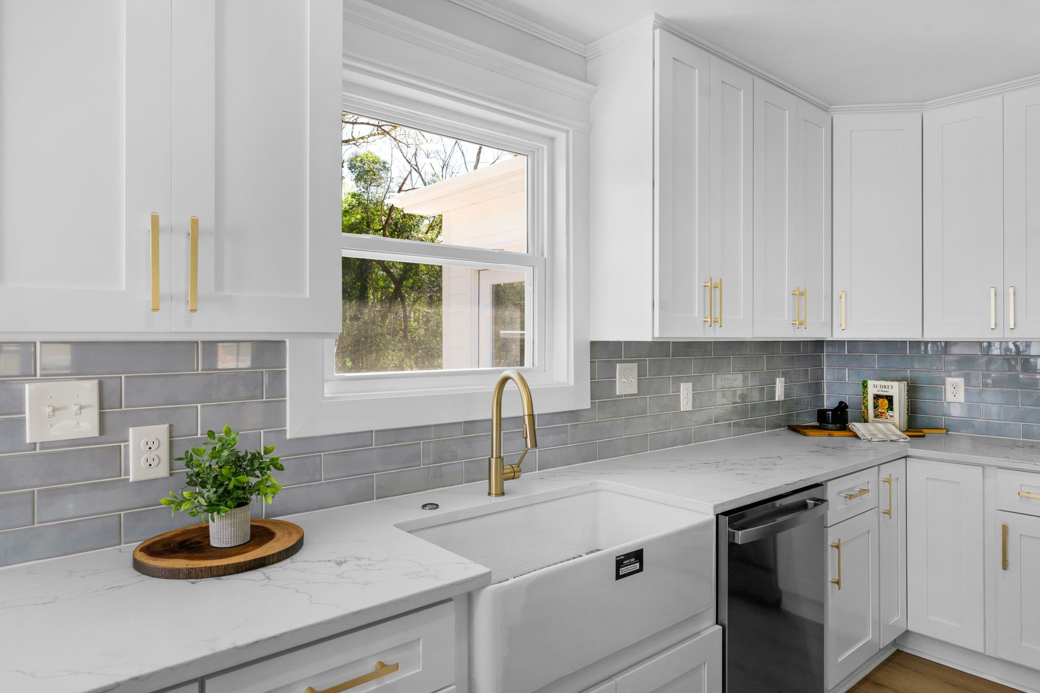 View from the living room toward the renovated kitchen and dining area — Wyanoke by Stillman Properties Charlotte NC