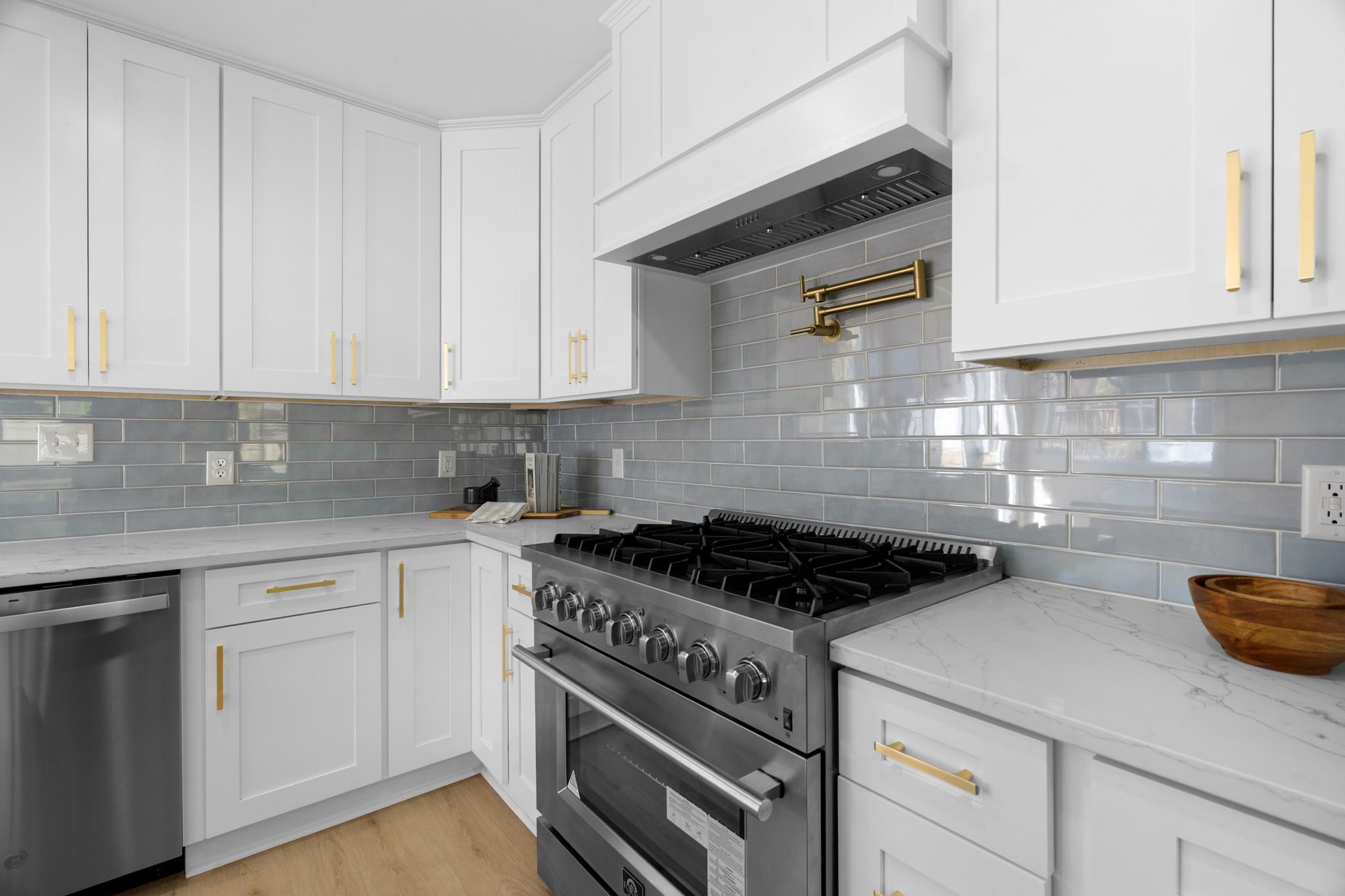Detail of the kitchen range, hood, and tile backsplash — Wyanoke by Stillman Properties Charlotte NC