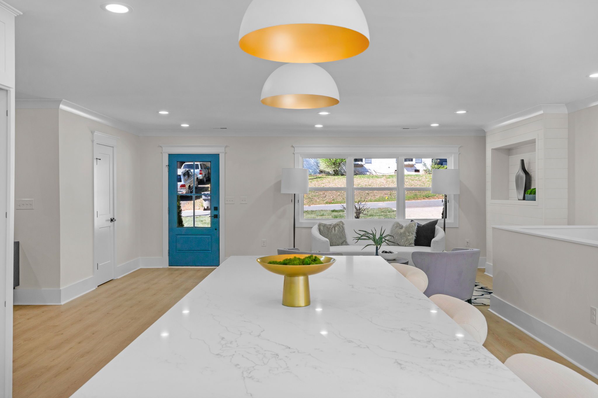 View through the renovated kitchen toward the foyer and front door — Wyanoke by Stillman Properties Charlotte NC