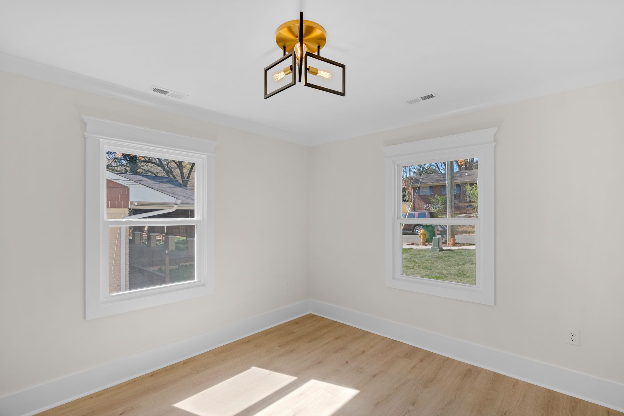 Additional secondary bedroom with natural light and modern light fixture — Wyanoke by Stillman Properties Charlotte NC