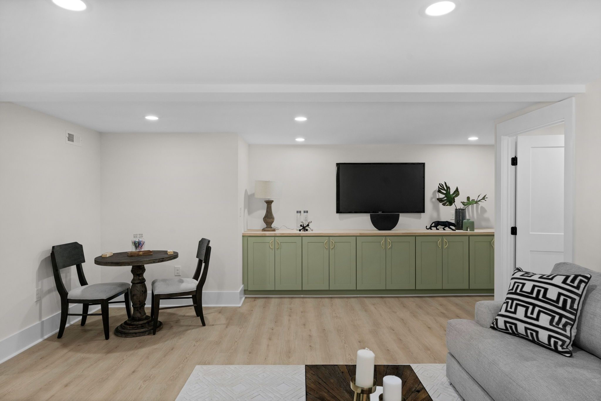 Lower-level living area with a casual dining space — Wyanoke by Stillman Properties Charlotte NC