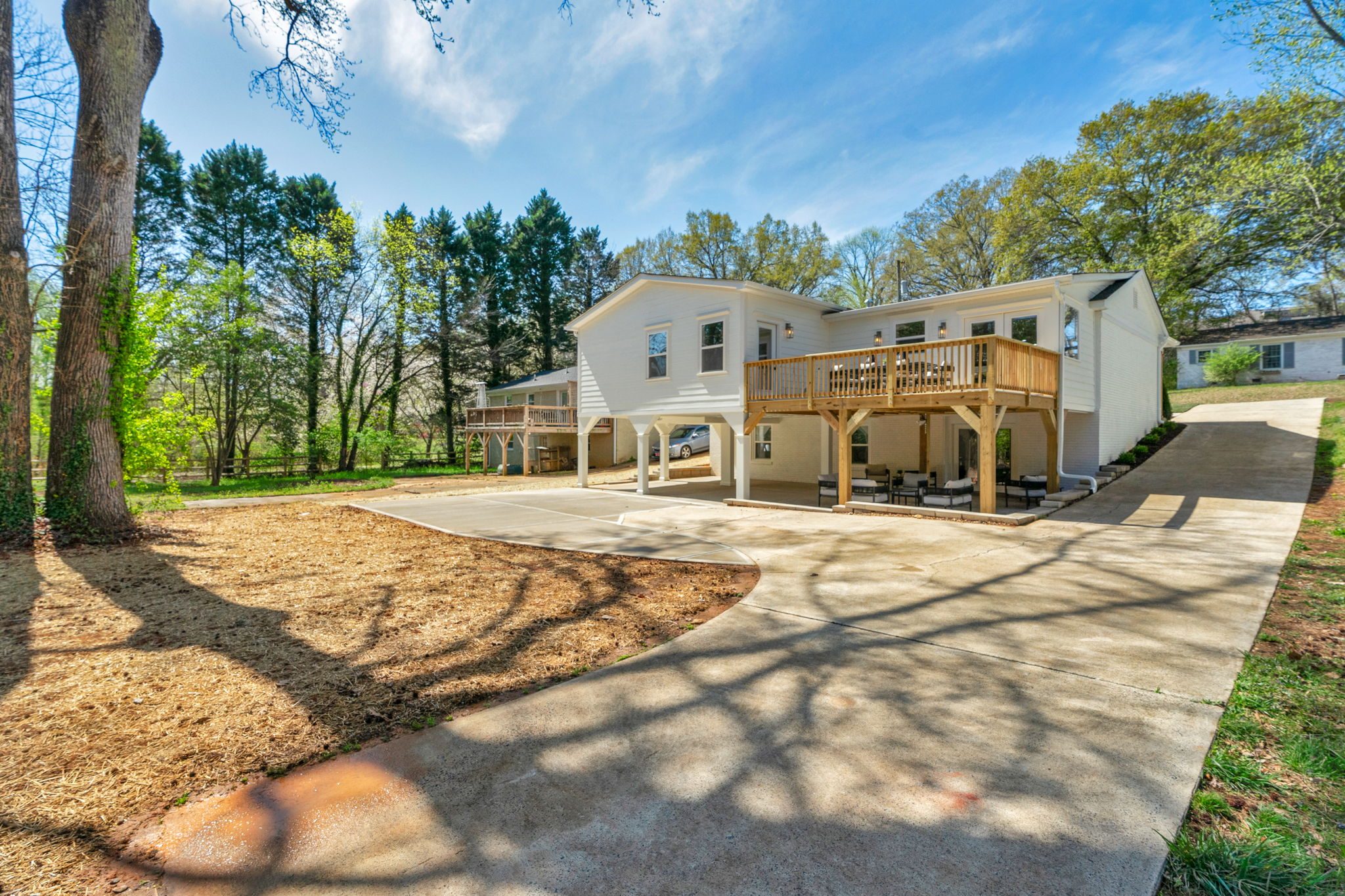 Expanded rear deck overlooking the wooded lot — Wyanoke by Stillman Properties Charlotte NC