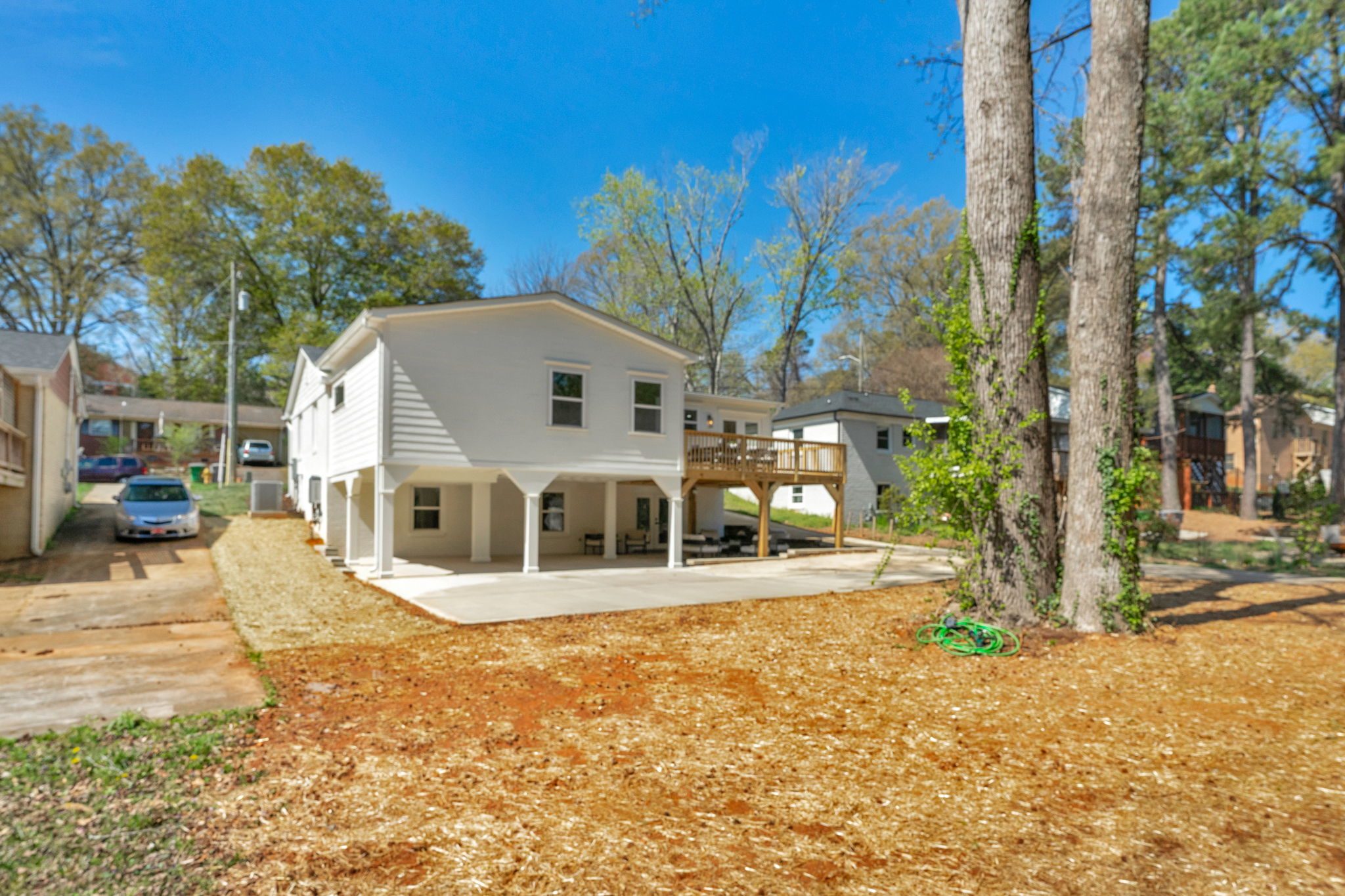 Rear elevation of the renovated home showing the walkout lower level — Wyanoke by Stillman Properties Charlotte NC